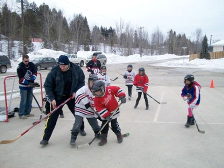 Kimberley cops grab sticks for ball hockey game with kids