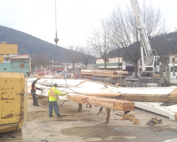 Crane removes massive glulam beams from Nelson Commons site