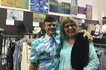 Nelson native Shawn Morris, with former City Councilor Donna Macdonald, has his display at Cotton Creek Clothing. — Deb Fuhr photos, The Nelson Daily