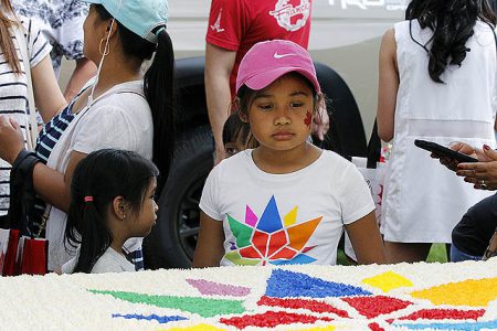 During the ceremony, this young girl had her eyes on the Canada Day Cake.
