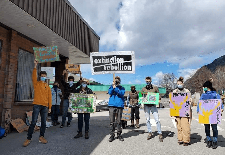 Demonstrators in solidarity with Fairy Creek Blockades rally outside office of Kootenay West MLA Katrine Conroy