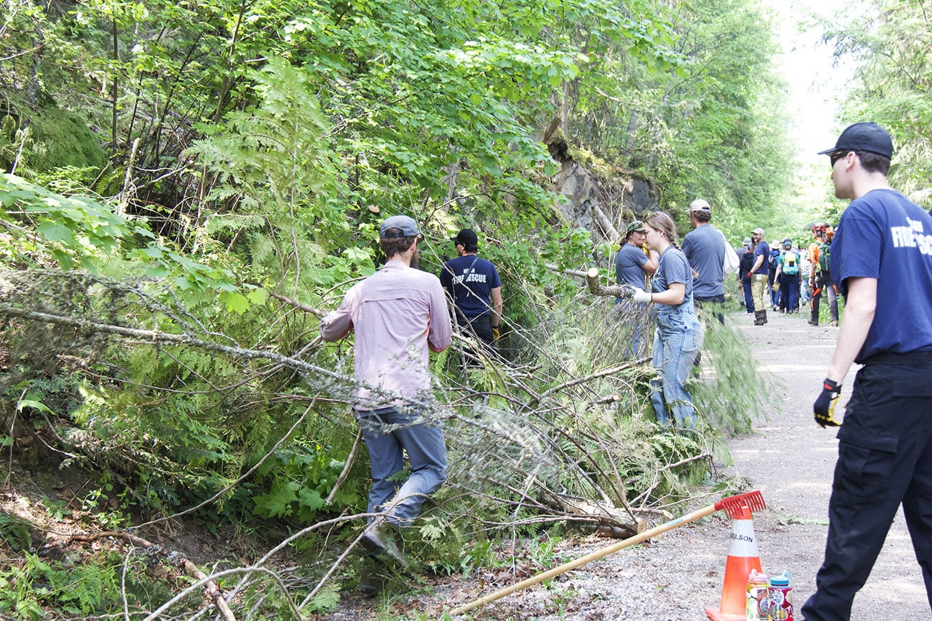 Volunteers help cleanup wildfire debris during Nelson Rail Trail FireSmart Day
